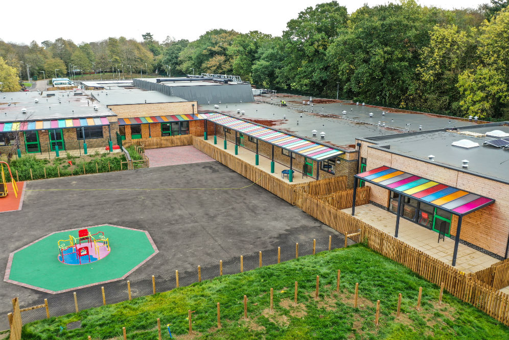 Riverwalk school canopy with a multi-coloured polycarbonate roof