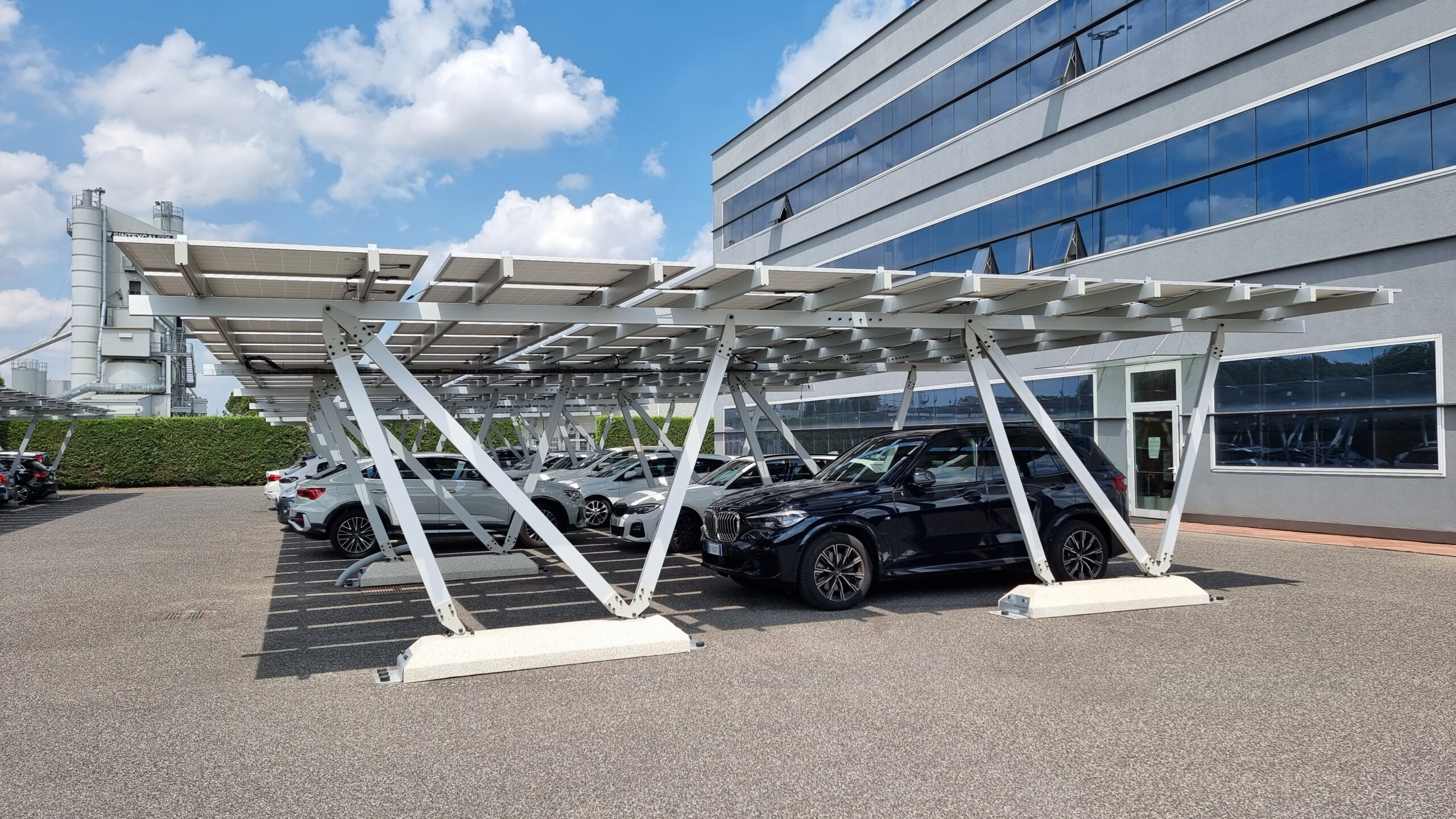 Cars underneath a solar powered canopy