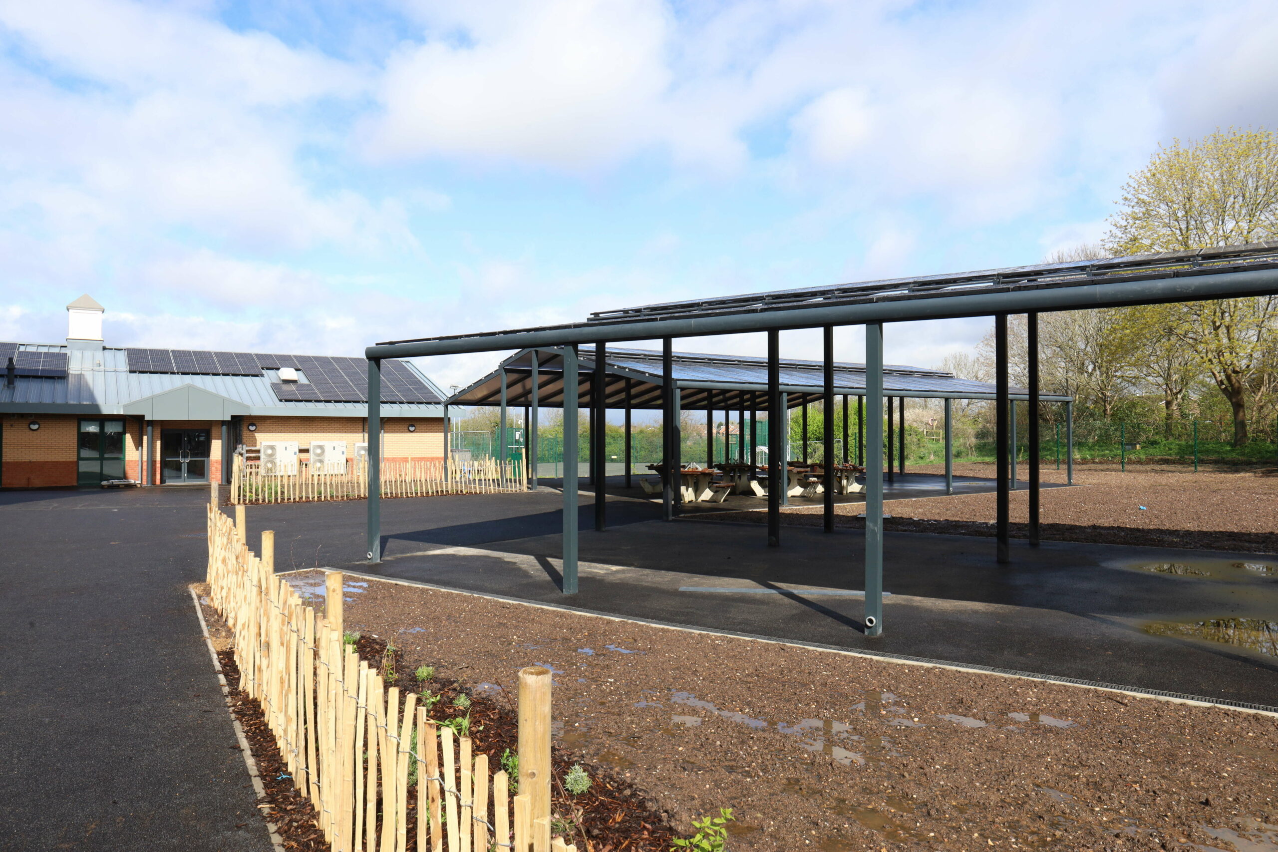 A side-on view of the two PV panel canopies at Southam College