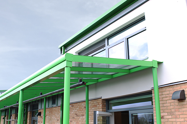A close up shot of the green mono-pitch canopy at Shrivenham Primary School