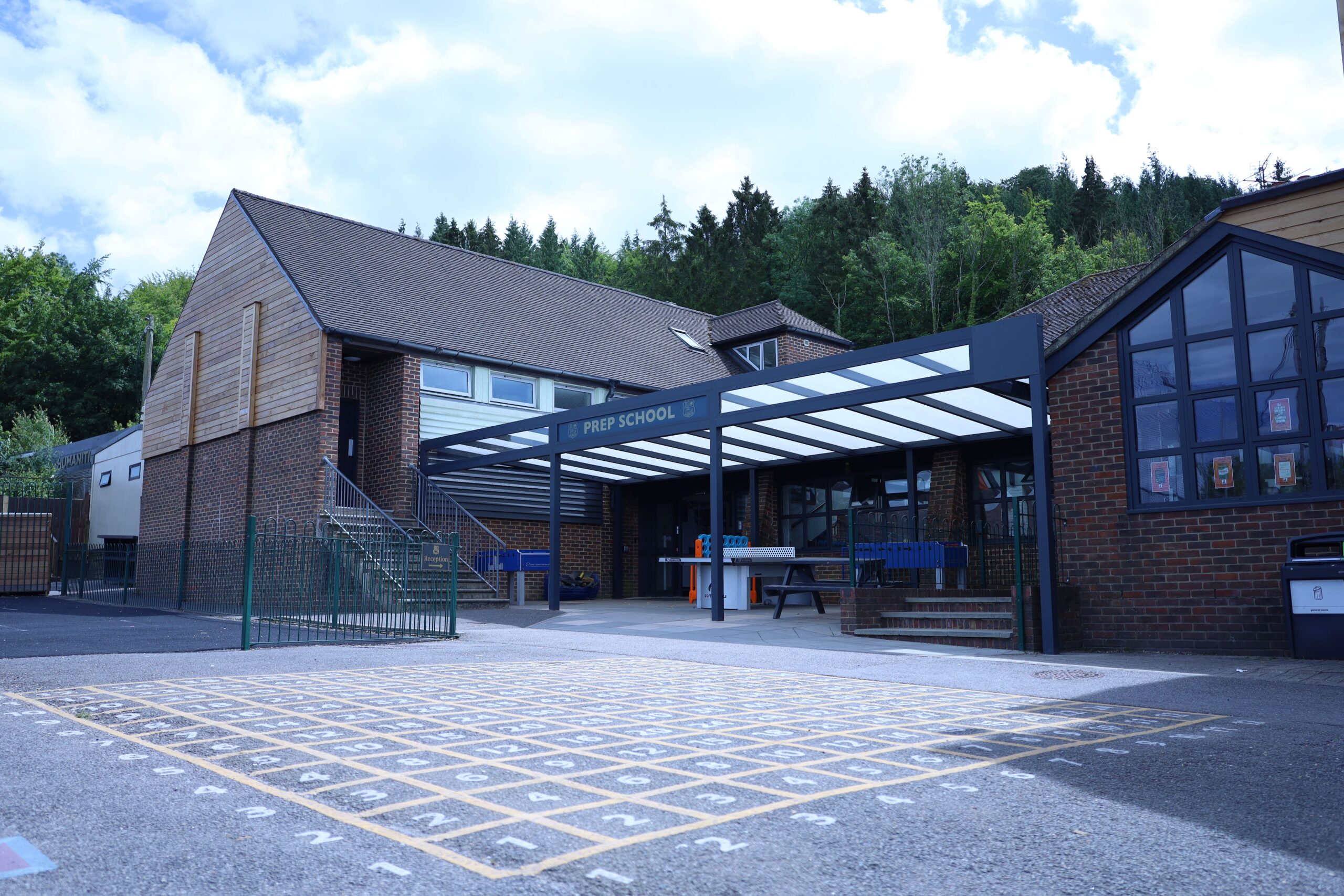 The playground area at Seaford College's Prep School sheltered by our Freestanding Mono-Pitch Canopy.